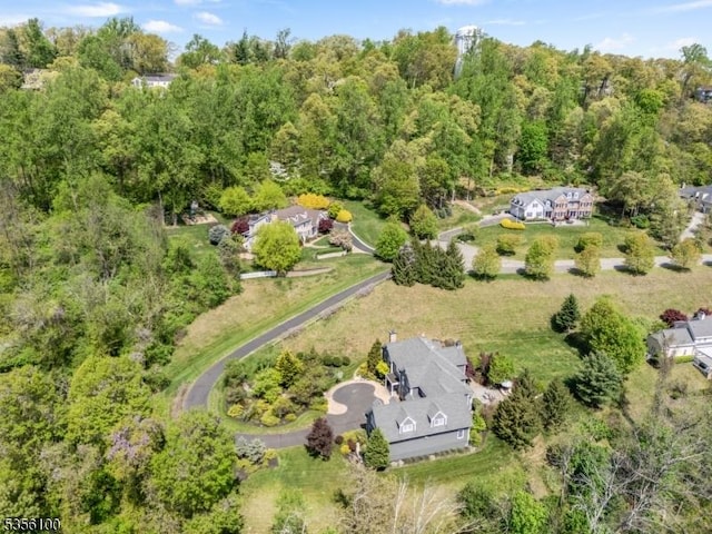 aerial overview of property's location featuring a forest