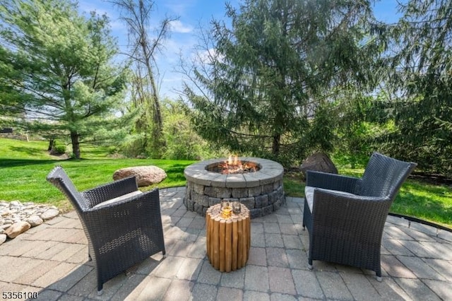view of patio with an outdoor fire pit
