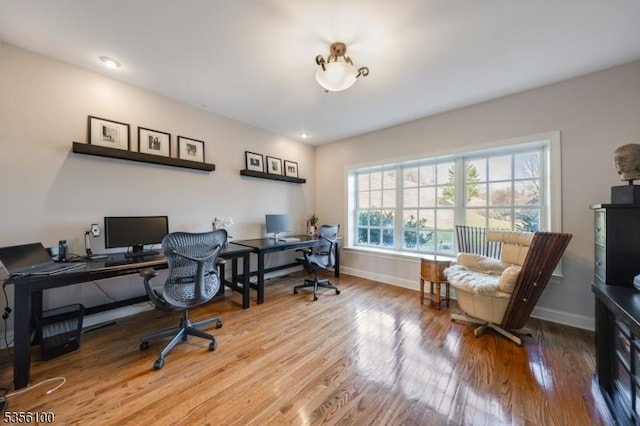 office with wood finished floors and baseboards