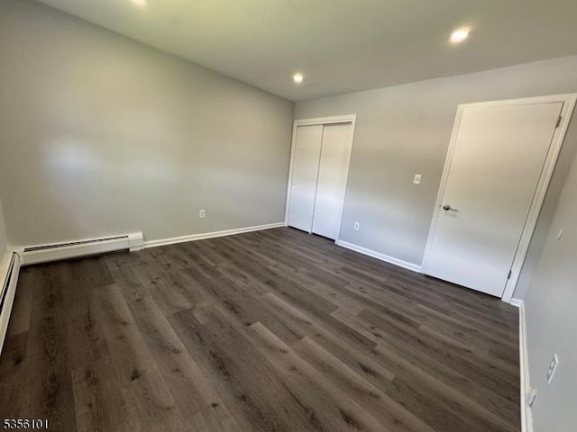 25 Ivy Pl, Vernon Twp, NJ 07418 - unfurnished bedroom featuring dark wood-style floors, baseboards, recessed lighting, baseboard heating, and a closet