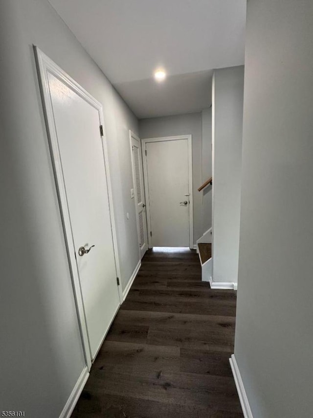 25 Ivy Pl, Vernon Twp, NJ 07418 - hall with dark wood-style floors, stairway, and baseboards