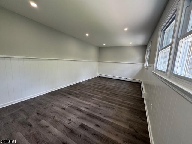 25 Ivy Pl, Vernon Twp, NJ 07418 - spare room with dark wood-style flooring, a baseboard radiator, a wainscoted wall, and recessed lighting