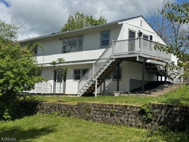 25 Ivy Pl, Vernon Twp, NJ 07418 - back of property featuring stairs, a wooden deck, and a yard