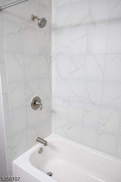 full bathroom with shower / bath combination