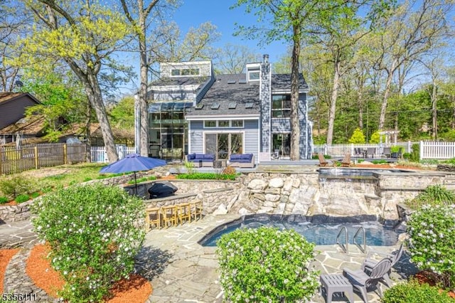 302 W Lakeshore Dr, Vernon Twp, NJ 07422 - rear view of house featuring an outdoor living space, a patio, fence, and outdoor dry bar