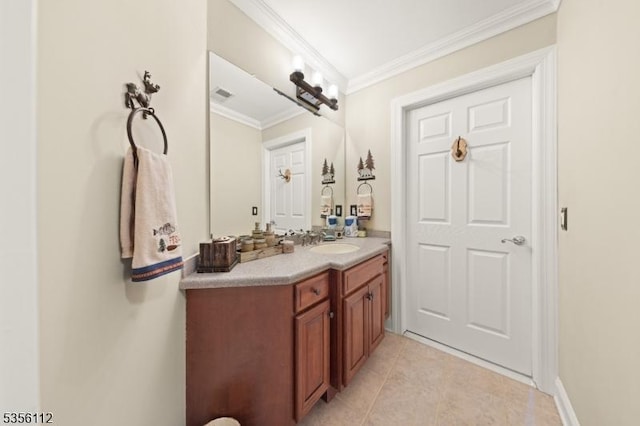 bathroom featuring vanity, crown molding, and tile patterned floors