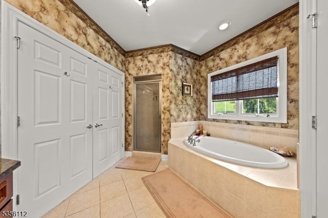 full bath with a garden tub, a stall shower, tile patterned floors, wallpapered walls, and vanity