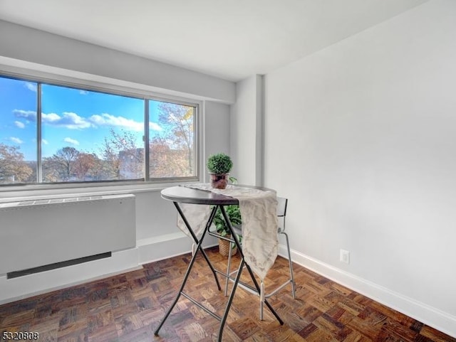 office space with baseboards