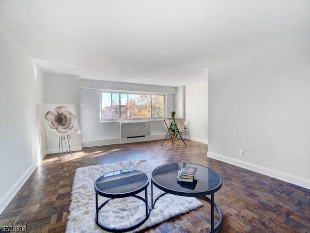 sitting room featuring baseboards