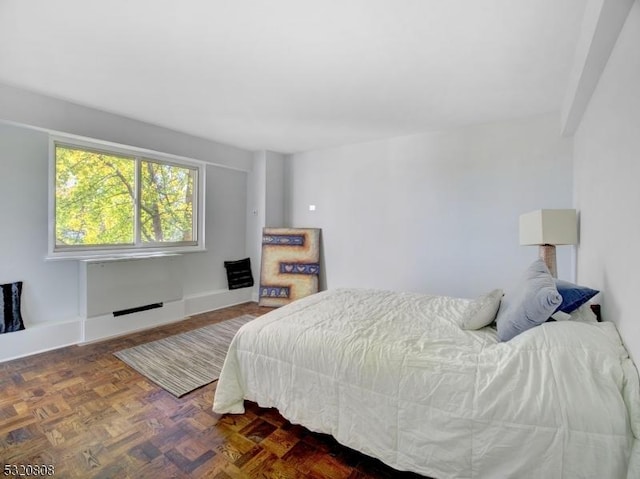 bedroom featuring baseboards