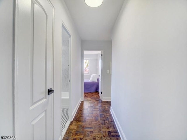corridor featuring baseboards