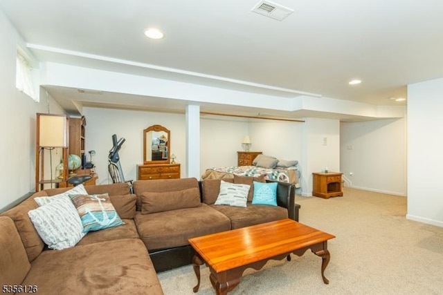 living room featuring light colored carpet, recessed lighting, and baseboards