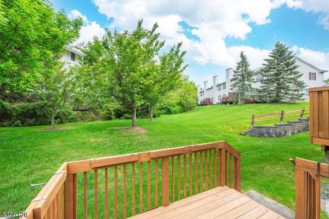 wooden deck with a yard