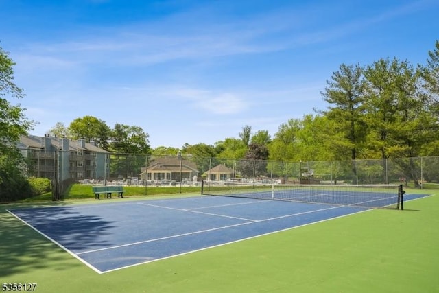 view of sport court featuring fence and community basketball court