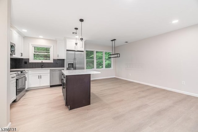 10 Maple Dr, Vernon Twp, NJ 07461 - kitchen with appliances with stainless steel finishes, backsplash, white cabinetry, light wood-style floors, and recessed lighting