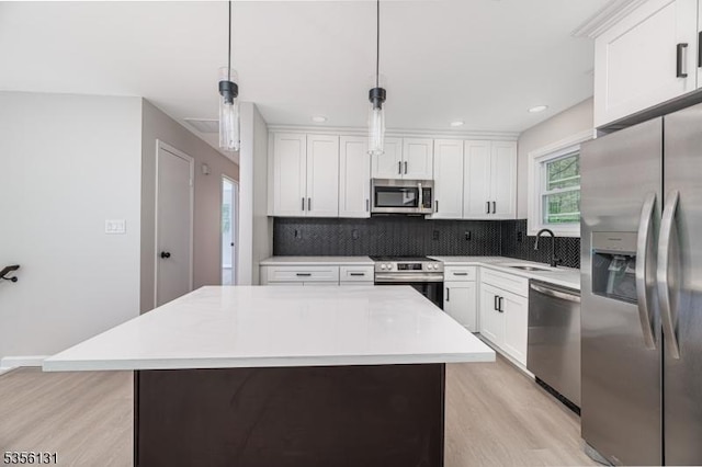 10 Maple Dr, Vernon Twp, NJ 07461 - kitchen with appliances with stainless steel finishes, a sink, decorative backsplash, light wood-style floors, and recessed lighting