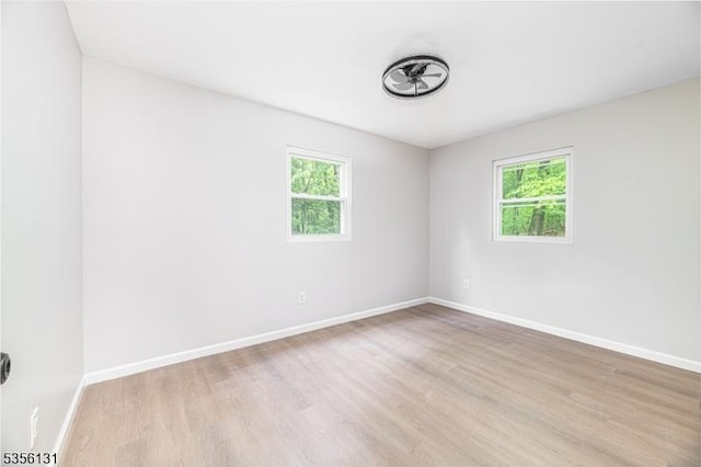 10 Maple Dr, Vernon Twp, NJ 07461 - unfurnished room with healthy amount of natural light, light wood finished floors, and baseboards