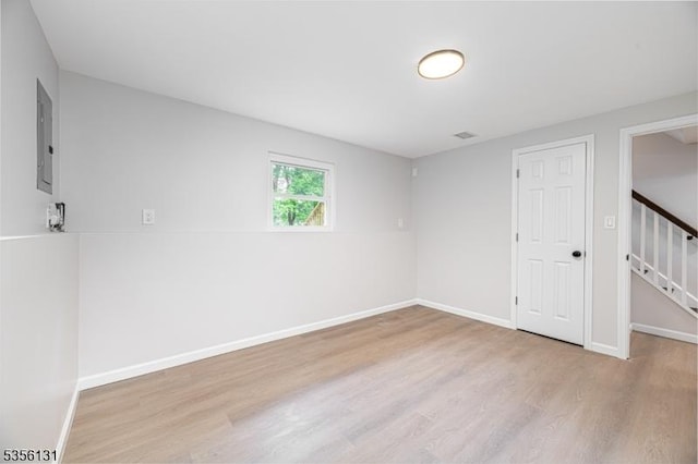 10 Maple Dr, Vernon Twp, NJ 07461 - spare room featuring wood finished floors, baseboards, electric panel, and stairs
