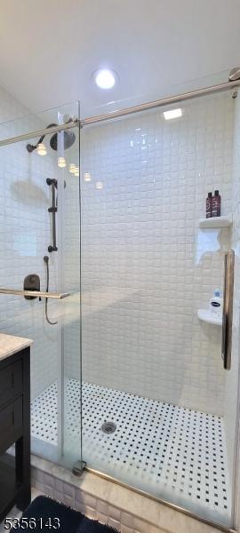 bathroom featuring vanity and a stall shower