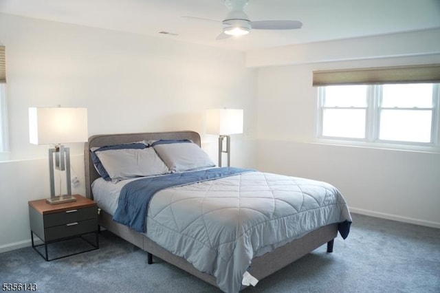 bedroom with baseboards, a ceiling fan, and carpet floors
