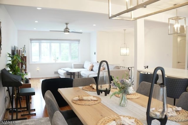 dining space featuring baseboards, recessed lighting, ceiling fan, and wood finished floors
