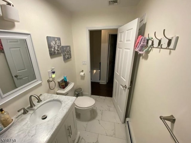 66 Lexington Ave, Rochelle Park Twp, NJ 07662 - bathroom with marble look tile flooring, a baseboard heating unit, vanity, toilet, and baseboards