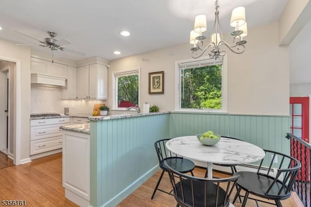 kitchen with white cabinetry, ceiling fan, tasteful backsplash, light wood-style flooring, and recessed lighting