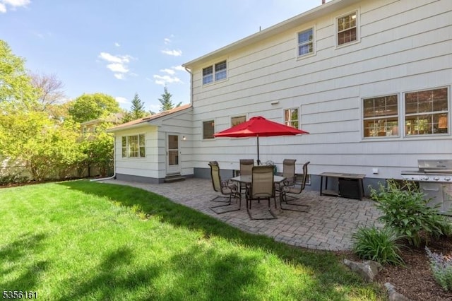 back of property featuring a patio