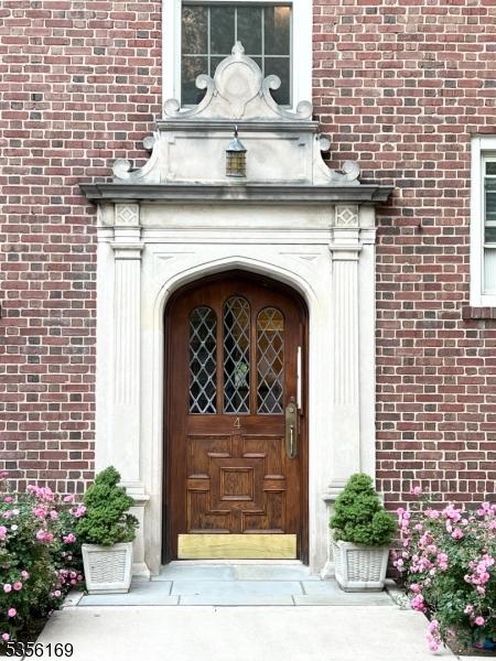 133 Summit Ave Unit 30, Summit City, NJ 07901 - view of exterior entry featuring brick siding
