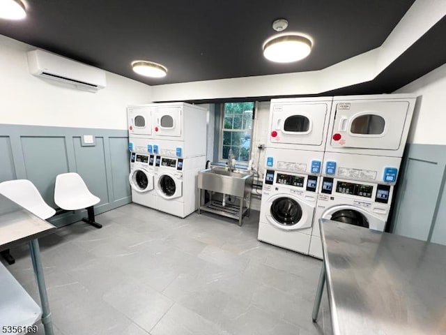 133 Summit Ave Unit 30, Summit City, NJ 07901 - communal laundry room featuring stacked washing machine and dryer, independent washer and dryer, an AC wall unit, and light tile patterned flooring