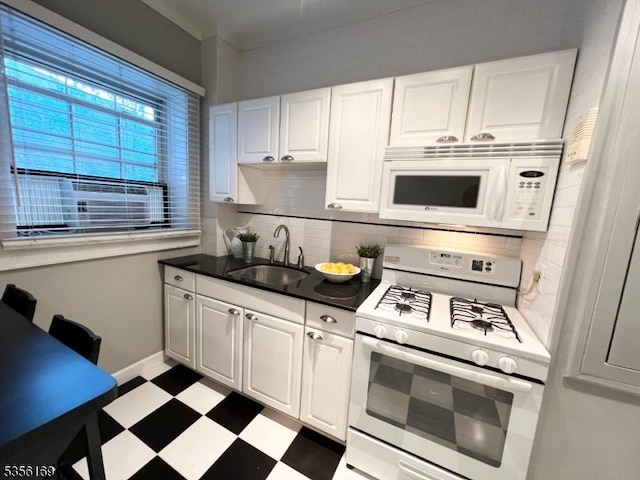 133 Summit Ave Unit 30, Summit City, NJ 07901 - kitchen featuring white appliances, dark flooring, tasteful backsplash, white cabinets, and dark countertops