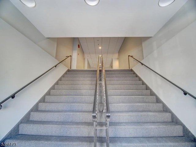 stairs featuring recessed lighting
