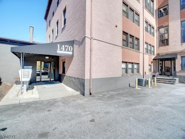 view of building exterior featuring cooling unit