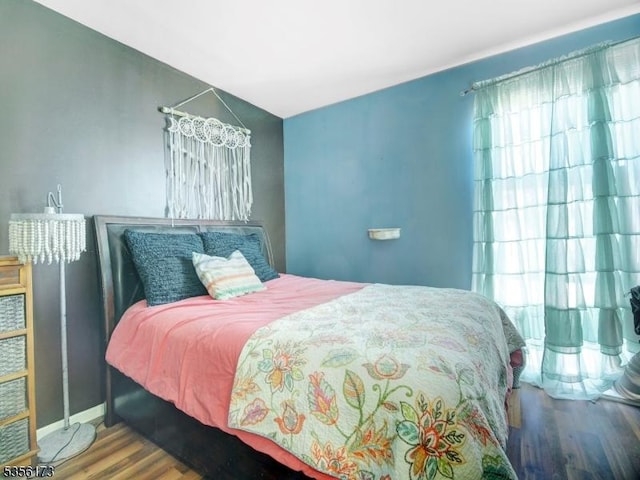 bedroom featuring wood finished floors