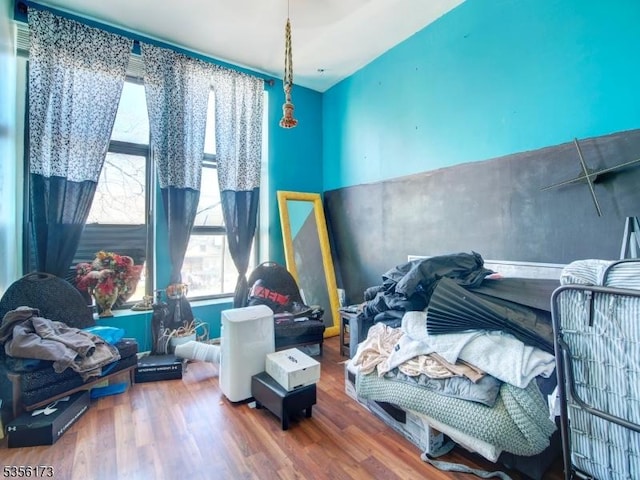 bedroom with wood finished floors