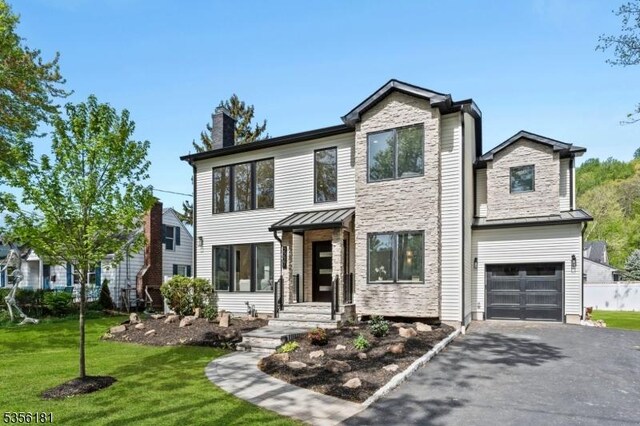 2227 Pine Ter, Scotch Plains Twp, NJ 07076 - modern home with a chimney, a standing seam roof, asphalt driveway, stone siding, and a garage
