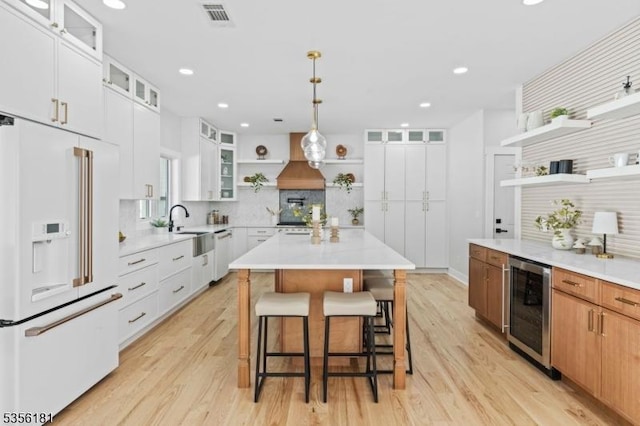2227 Pine Ter, Scotch Plains Twp, NJ 07076 - kitchen with open shelves, high end white fridge, beverage cooler, dishwashing machine, and tasteful backsplash