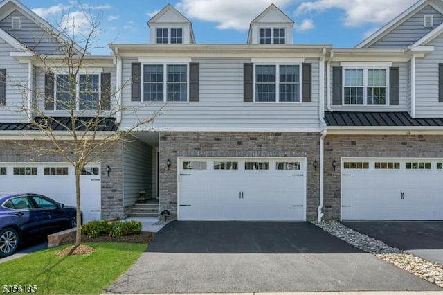 2 Lee Dr, Morris Twp, NJ 07960 - view of property featuring a garage, driveway, and stone siding