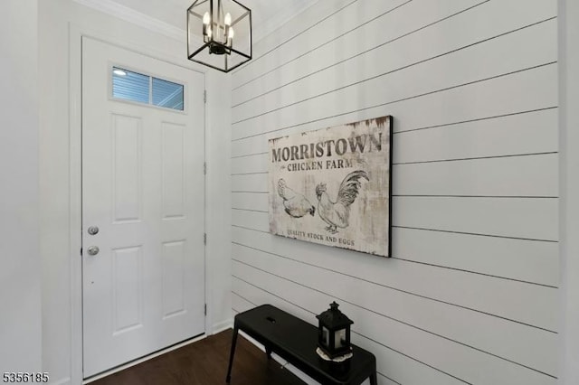 2 Lee Dr, Morris Twp, NJ 07960 - entrance foyer with a chandelier, crown molding, dark wood-type flooring, and wooden walls