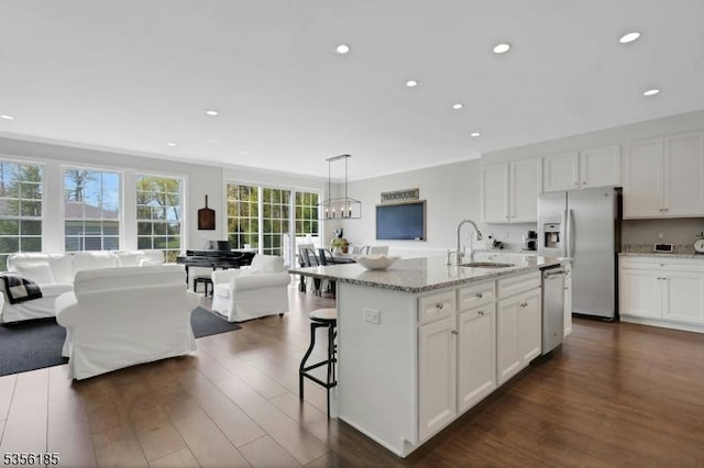 2 Lee Dr, Morris Twp, NJ 07960 - kitchen with stainless steel appliances, dark wood finished floors, recessed lighting, white cabinets, and a sink
