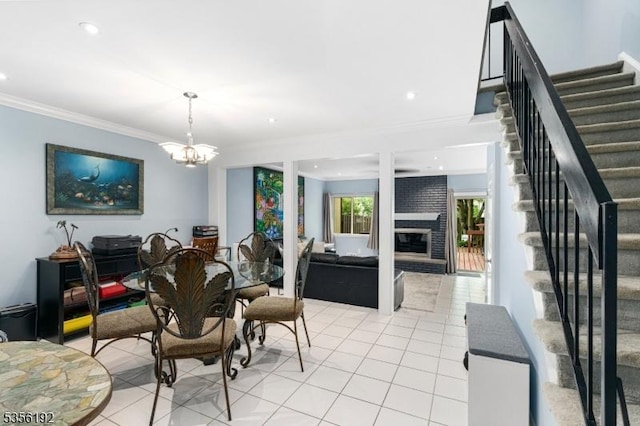130 Chelsea Way, Bridgewater Twp, NJ 08807 - dining area with light tile patterned flooring, stairs, ornamental molding, a brick fireplace, and a chandelier