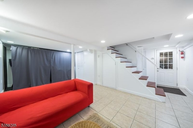 living area featuring stairs, tile patterned flooring, recessed lighting, and baseboards