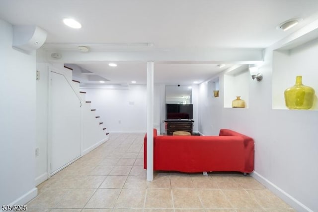 lobby featuring stairs and recessed lighting