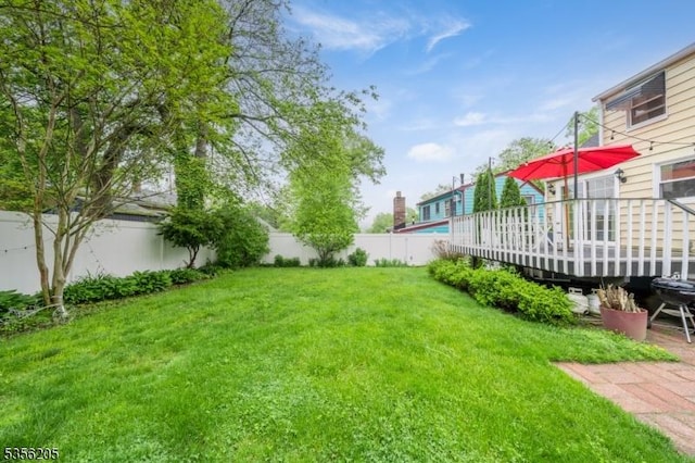 view of yard with a deck