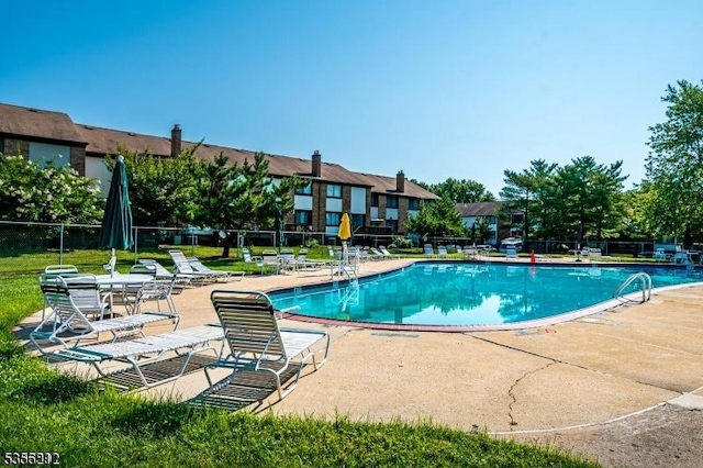 899 Robin Rd Unit 899, Hillsborough Twp, NJ 08844 - community pool with a patio and fence