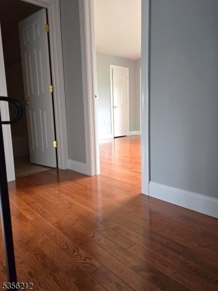 899 Robin Rd Unit 899, Hillsborough Twp, NJ 08844 - spare room with wood finished floors and baseboards