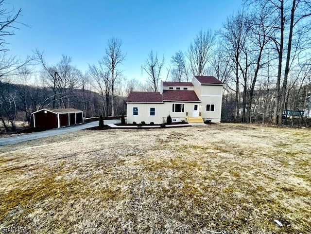 37 Snover Rd, Wantage Twp, NJ 07461 - rear view of house with a detached carport and an outdoor structure