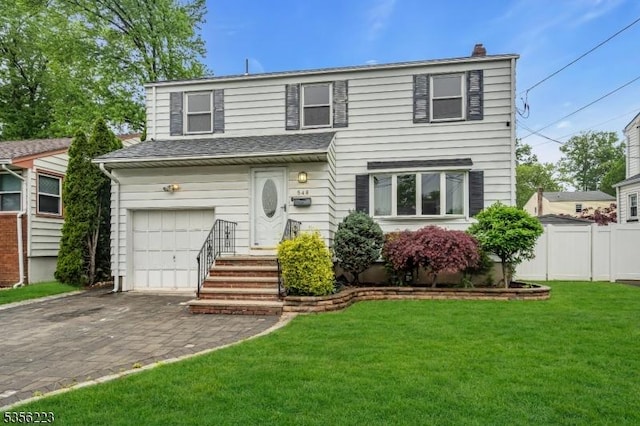 548 Birchwood Rd, Linden City, NJ 07036 - view of front facade with a garage, decorative driveway, and a chimney