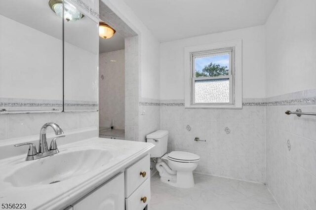 548 Birchwood Rd, Linden City, NJ 07036 - bathroom featuring tile walls, vanity, a wainscoted wall, and toilet