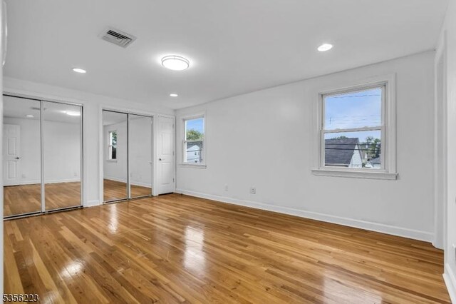 548 Birchwood Rd, Linden City, NJ 07036 - unfurnished bedroom featuring light wood-style floors, two closets, baseboards, and recessed lighting